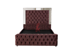 Velvet upholstered bed in burgundy by Sofas & Beds Limited