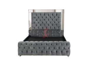 Velvet upholstered bed in grey by Sofas & Beds Limited