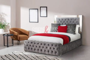 Velvet upholstered bed in grey by Sofas & Beds Limited